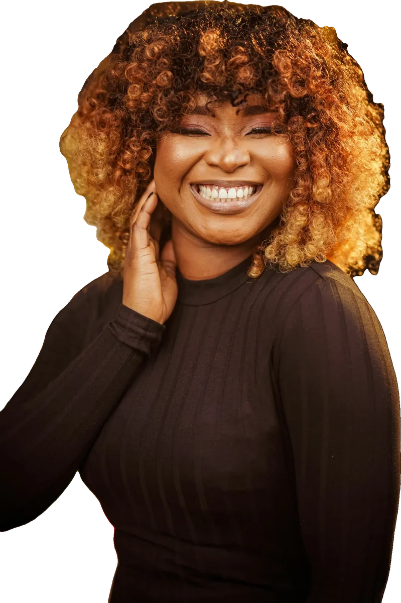 Model wearing a honey water-curl wig